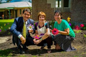 Geoff Lee, Bonney, Tash Burrell with flowers in garden